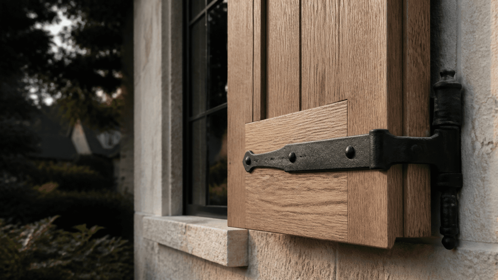 Oak exterior shutter fitted with forged black hardware
